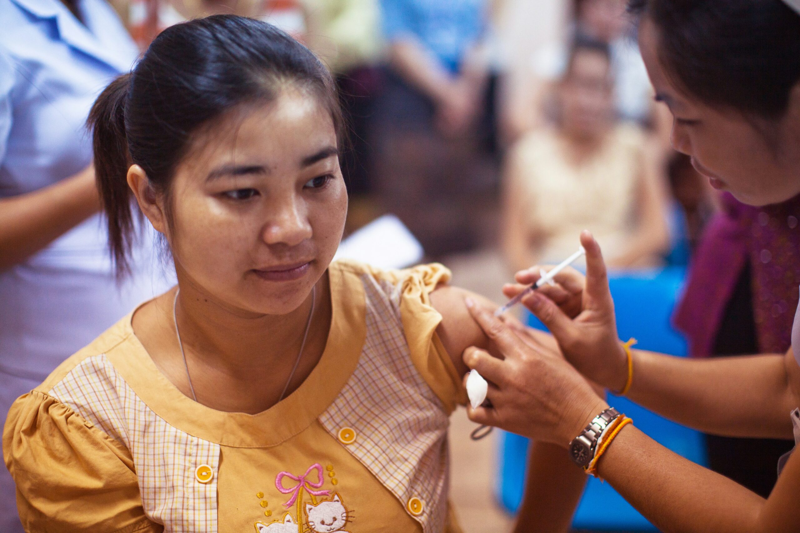 Woman being vaccinated in a health center