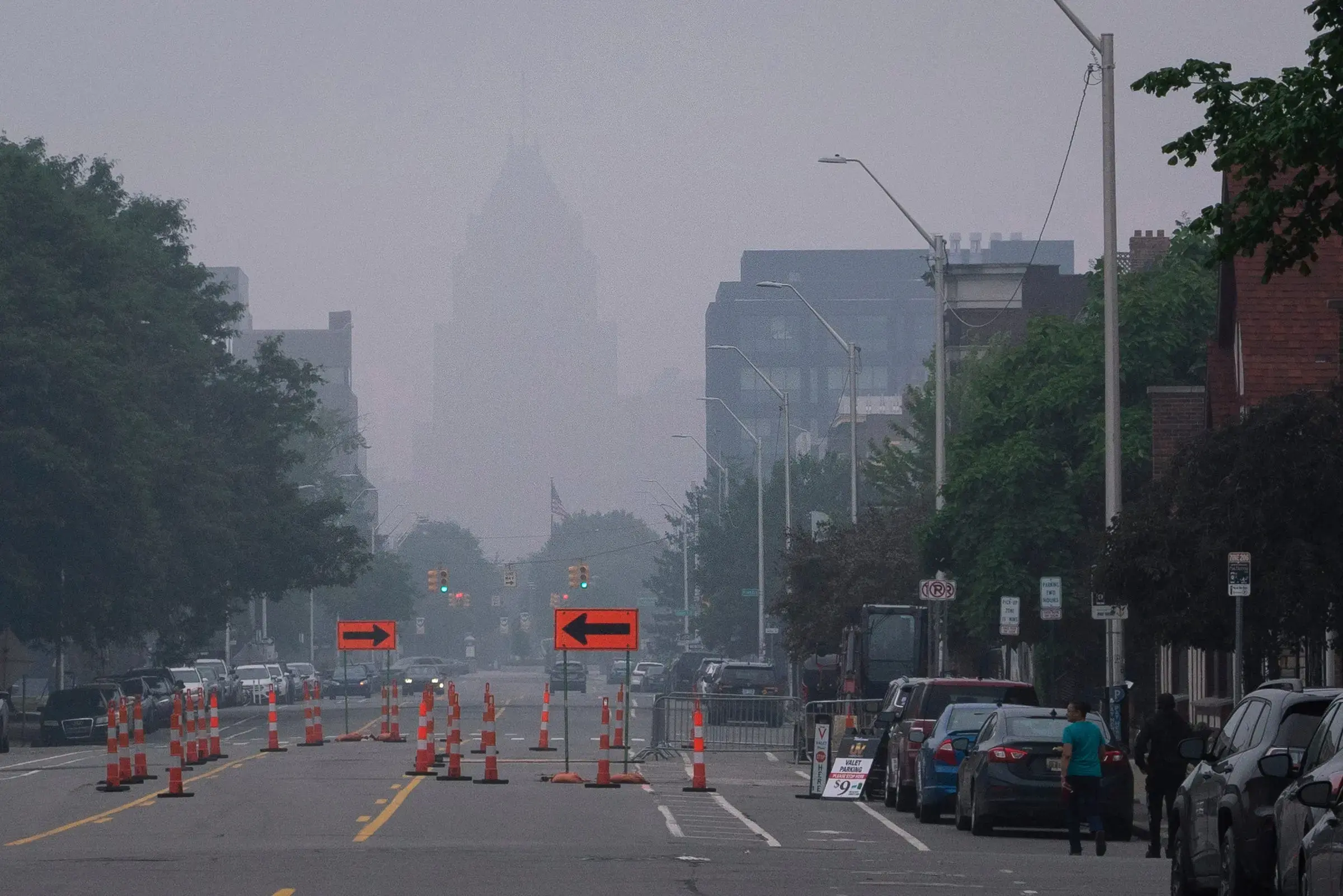 The Fisher Building in Midtown Detroit is barely visible through haze and smoke, caused by the millions of acres burned by wildfires in Canada, on June 27, 2023. Image by Sarahbeth Maney/Detroit Free Press. United States.