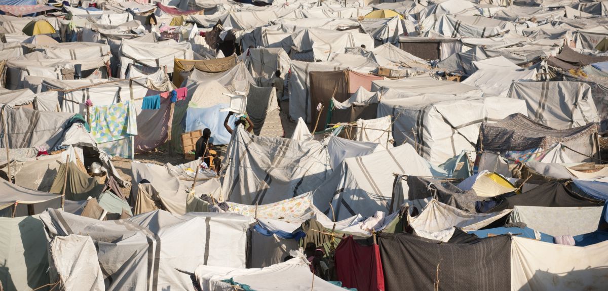 refugee camp in Haiti showing dozens of improvised tents